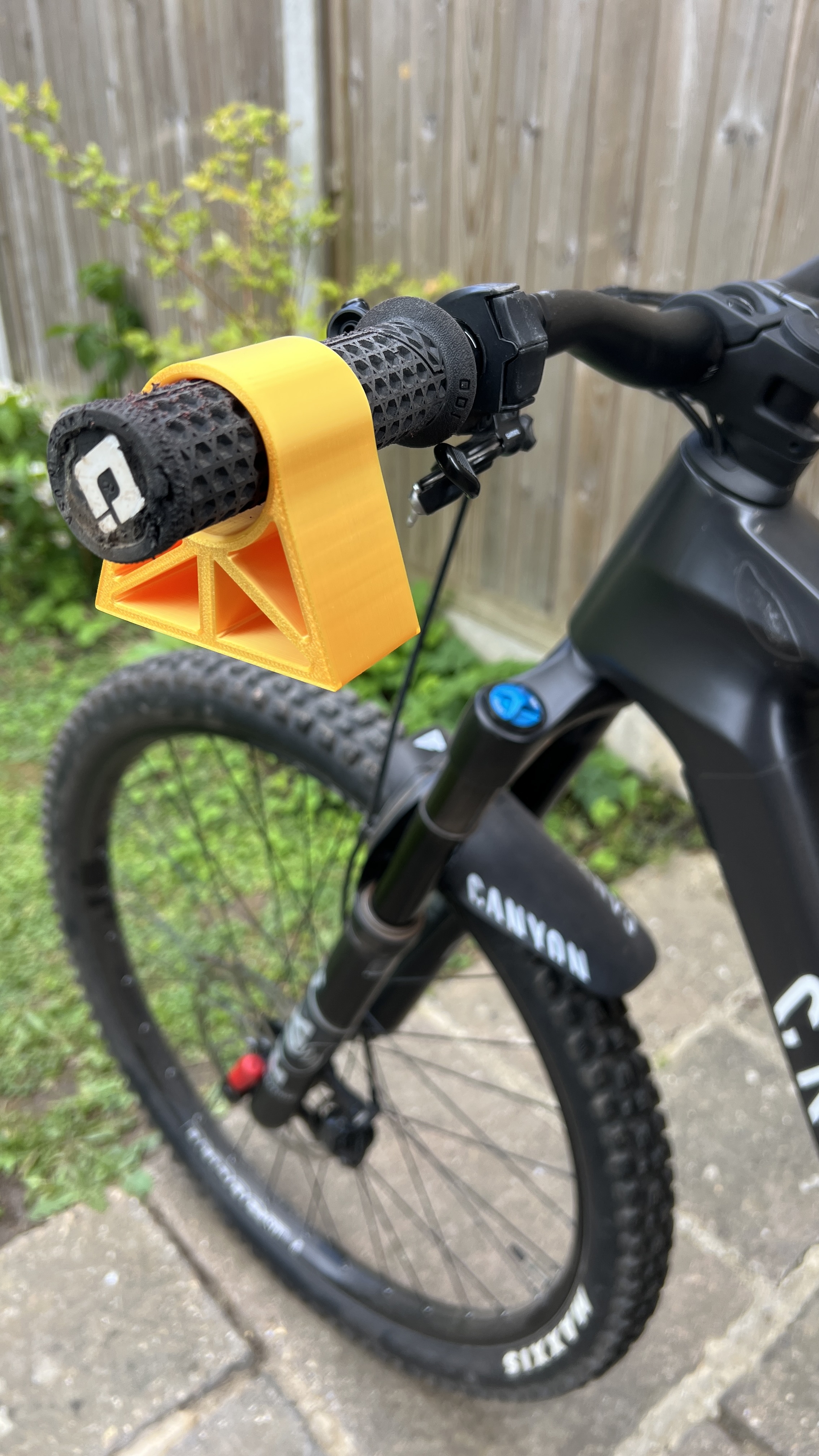 Bar Guards yellow handlebar guard on black Canyon mountain bike